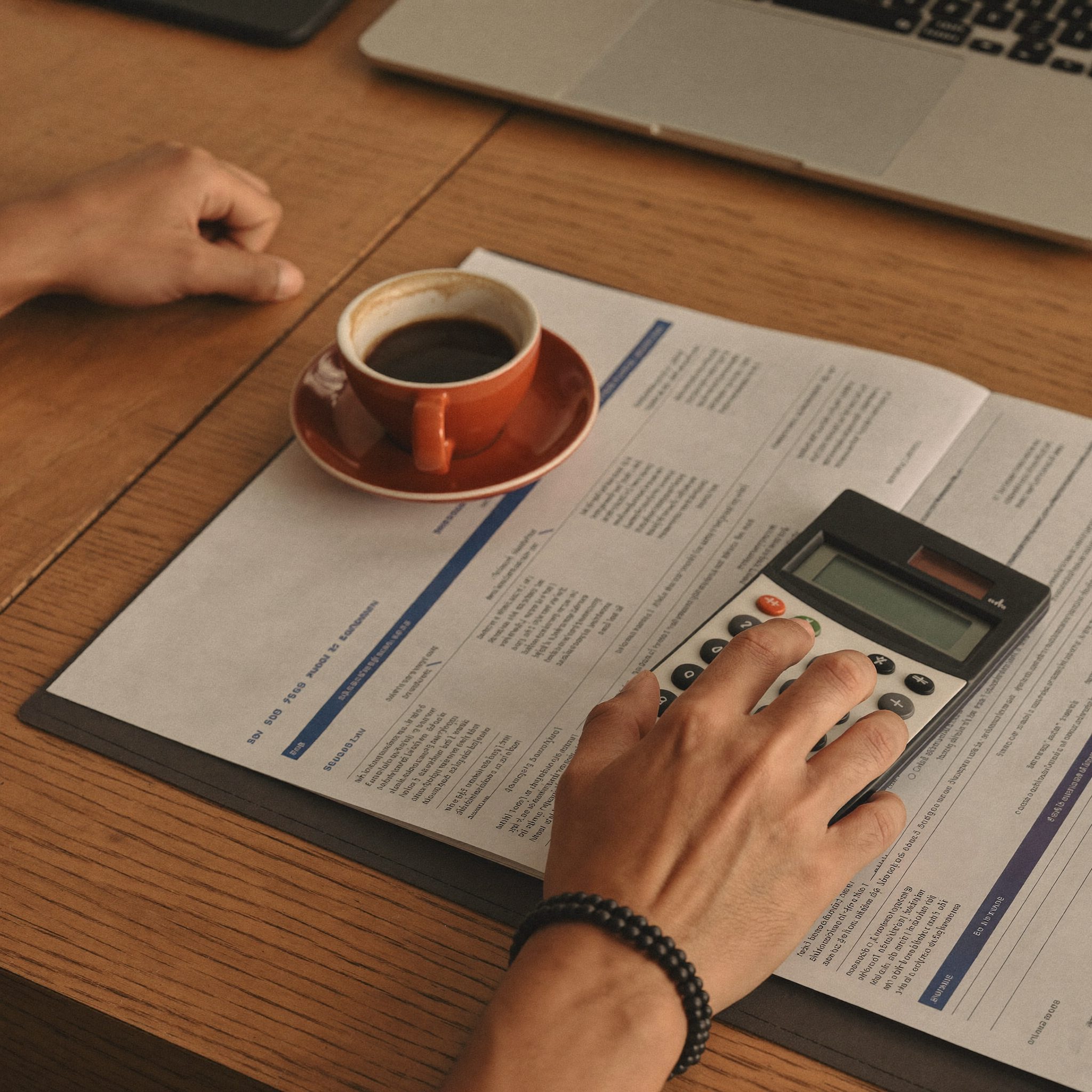 Close-up of financial documents being reviewed and reconciled